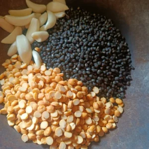 Roasting urad dal,chana dal and garlic