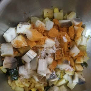 Add cooked raw banana and sambar powder